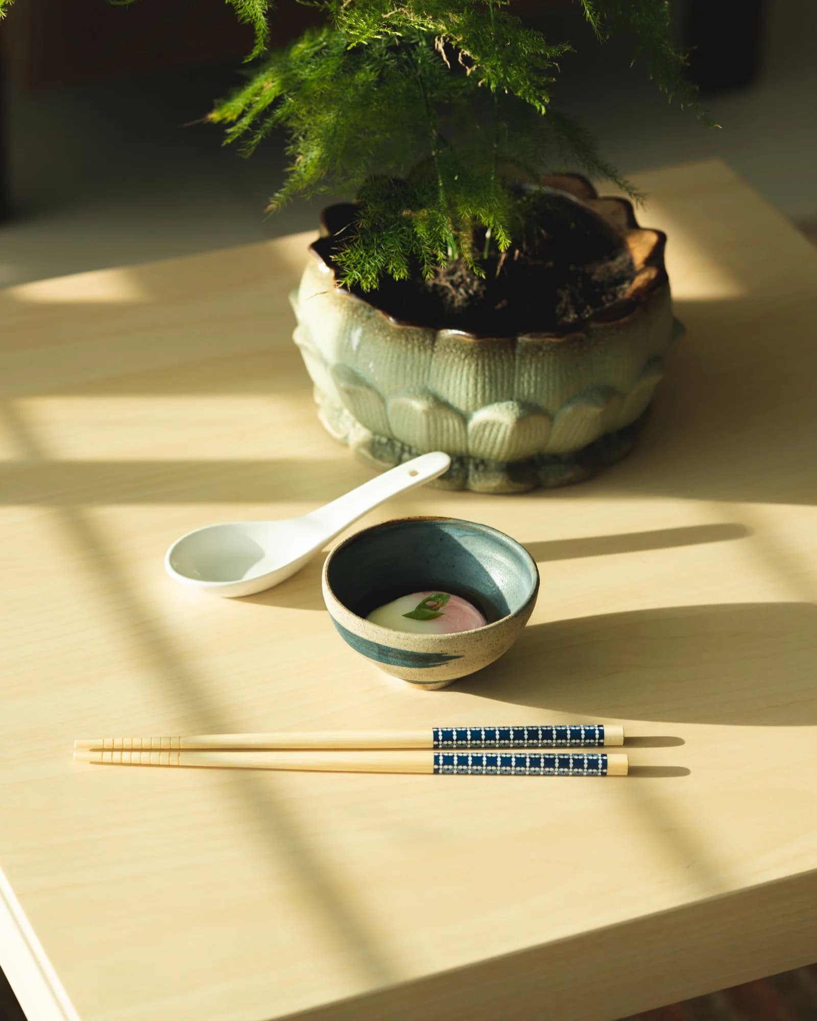 Onsen egg in handmade ceramic bowl with natural sunlight